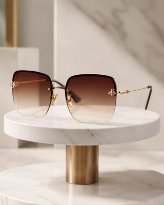 عینک آفتابی Gucci GG0982S با فریم فلزی طلایی و لنز گرادیانی قهوه‌ای