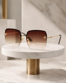 عینک آفتابی Gucci GG0982S با فریم فلزی طلایی و لنز گرادیانی قهوهای