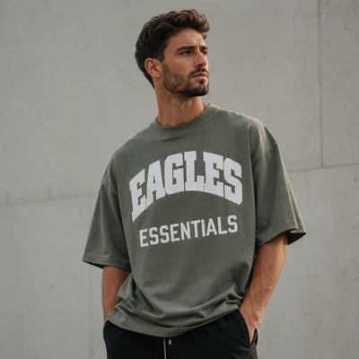 تیشرت مردانه لش باکسی سبز ماچا جلو چاپ |طرحEAGLES ESSENTIALS | استایل خیابانی مدرن
